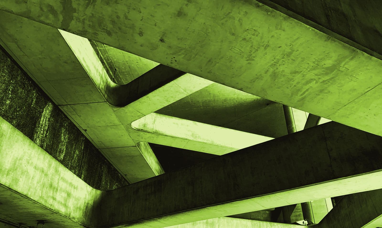 A concrete structure photographed against a flat sky
