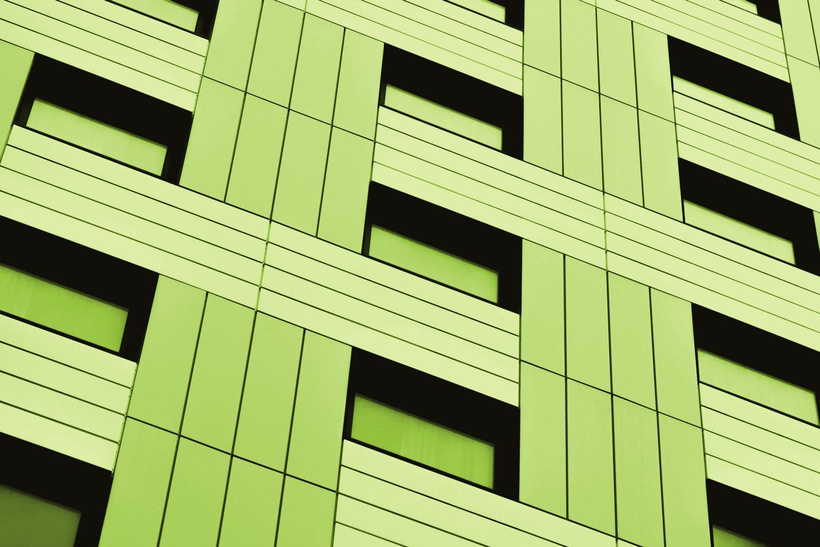 A regular grid of windows across a building facade